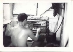 Inside the FDC bunker at C-2.  Dewitt Allen is operating the FADAC computer.